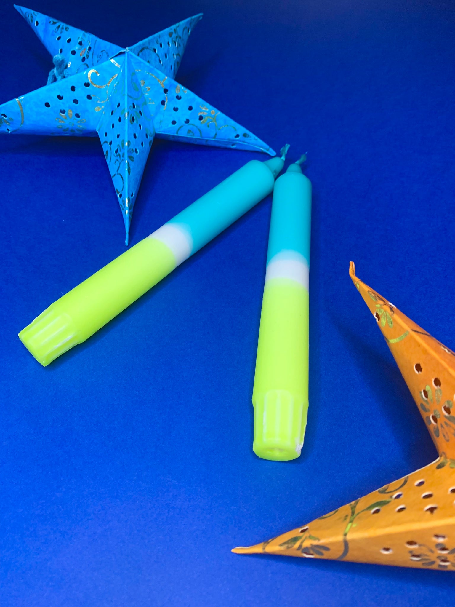 2 Blue and yellow neon candles