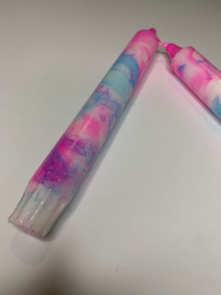 2 pink and blue marble candles